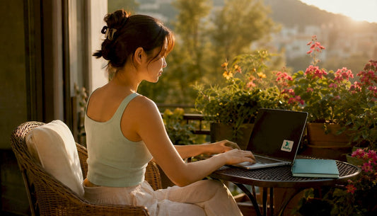 Woman typing showing shoulder muscle tension